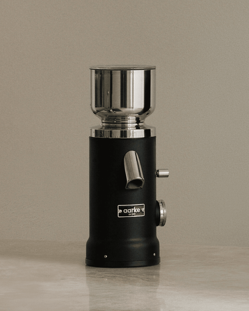 Aarke Coffee Grinder in Matte Black, featuring a stainless steel bean hopper, flat burr grinder and adjustable grind settings.