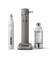 Aarke Carbonator 3 in Matte grey displayed with a 100% renewable CO₂ cylinder next to a filled PET water bottle.