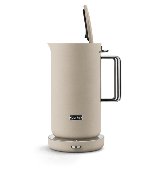 AARKE Kettle Sand electric kettle with lid open, featuring a stainless steel handle and minimalist Scandinavian design.