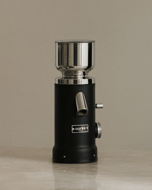 Aarke Coffee Grinder in Matte Black, featuring a stainless steel bean hopper, flat burr grinder and adjustable grind settings.