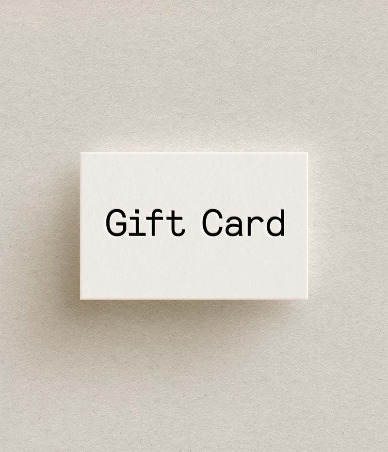 White Aarke gift card with 'Gift Card' text on a beige background