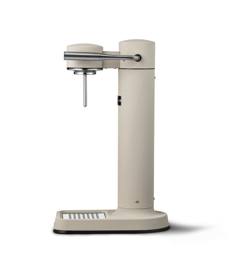 Side profile view of the Aarke Carbonator 3 in Sand finish, showcasing its minimalist silhouette and matte texture.