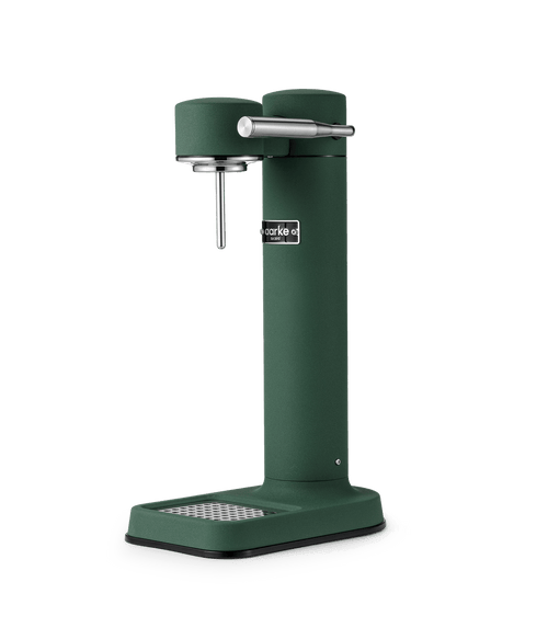 Aarke Carbonator 3 in Heritage Green, a premium sparkling water maker with a stainless steel carbonation nozzle and drip tray.