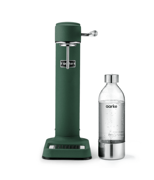 Aarke Carbonator 3 Heritage Green, a SodaStream sparkling water maker standing next to an Aarke BPA-free PET water bottle with a stainless steel cap.