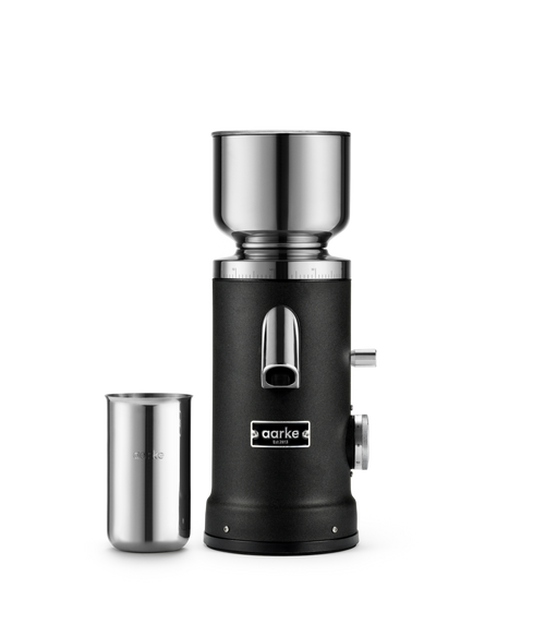 Aarke Coffee Grinder in Matte Black with stainless steel coffee grounds cup.