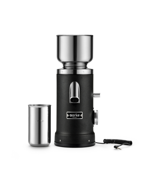 Aarke Coffee Grinder in Matte Black with stainless steel coffee grounds cup and autogrind cord for connection with the Aarke Coffee Maker.