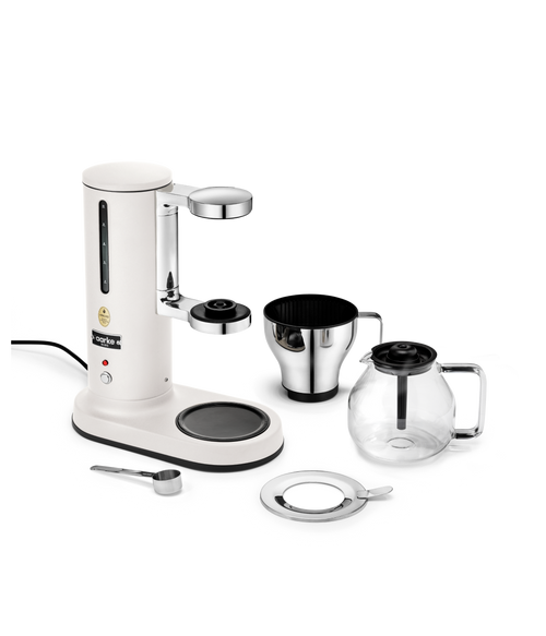 Aarke Matte White automatic pour-over coffee maker with stainless steel filter cone, glass coffee carafe and measuring scoop – premium Scandinavian drip coffee brewer.