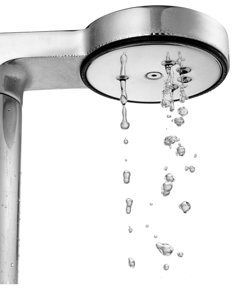 Close-up of Aarke Matte White coffee maker shower head dispersing hot water for even pour-over extraction.
